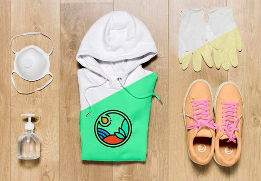Free Top View Folded Hoodie Mock-Up With Shoes Mask And Gloves Psd