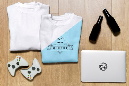 Free Top View Folded Hoodies Mock-Up With Controllers And Tablet Psd