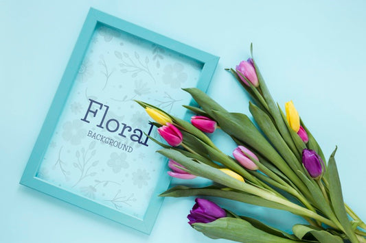 Free Top View Frame With Flowers Beside Psd