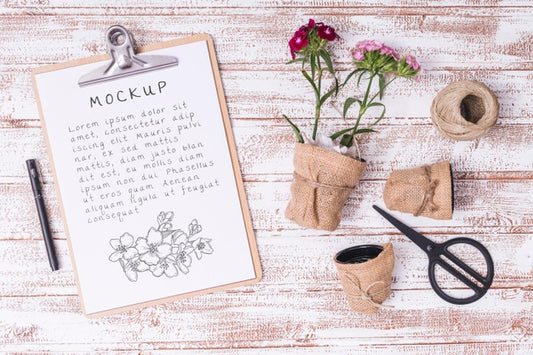 Free Top View Gardening Tools And Flowers With Clipboard Mock-Up Psd