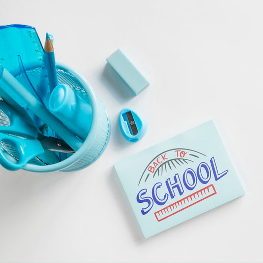 Free Top View Glass With School Supplies And Eraser Psd