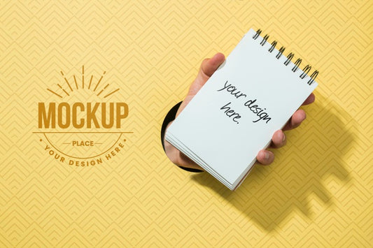 Free Top View Hand Holding Notebook Psd