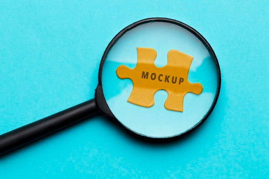 Free Top View Magnifying Glass On A Piece Of Puzzle Psd