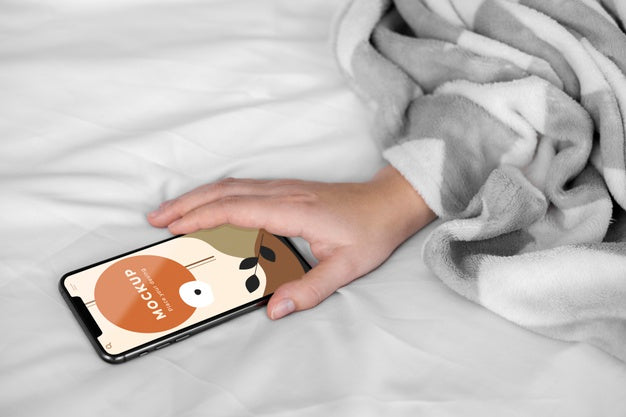 Free Top View Mobile On Bed Psd