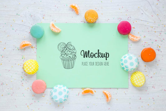 Free Top View Mock-Up With Candies And Orange Slices Psd