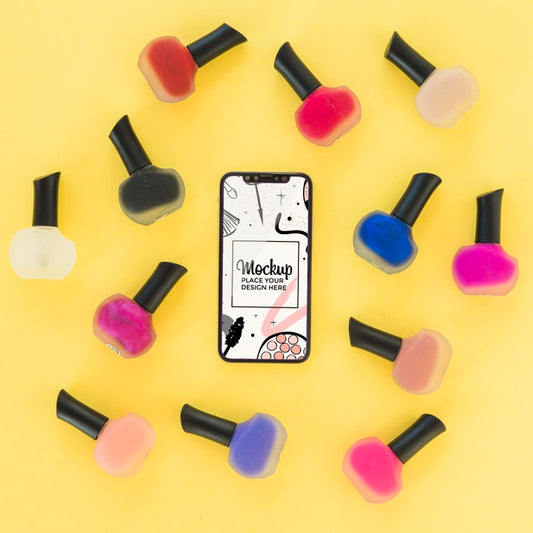 Free Top View Mock-Up With Nail Polish And Mobile Phone Psd