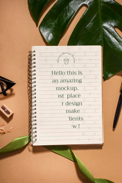 Free Top View Notebook And Monstera Plant Psd