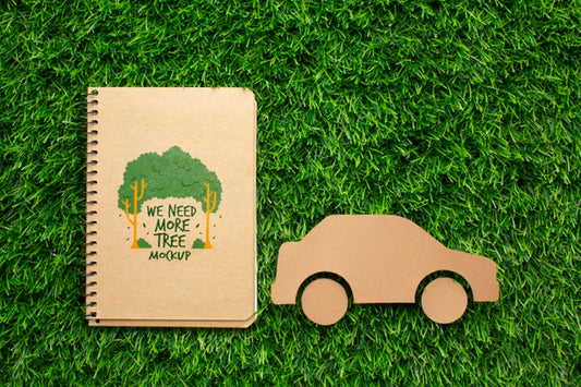 Free Top View Notebook Mock-Up And Paper Car Psd