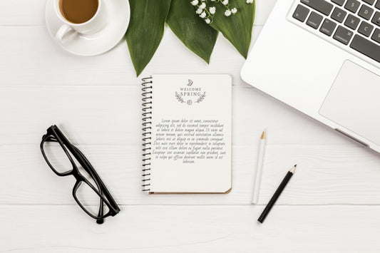 Free Top View Notebook With Eyeglasses And Laptop Psd