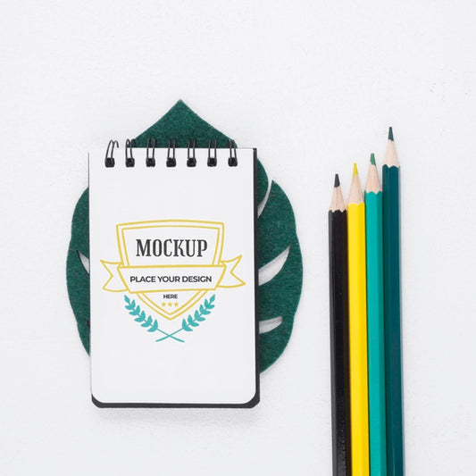 Free Top View Notepad Mock-Up Next To Stationery Elements Psd