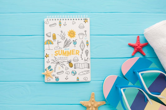Free Top View Notepad With Flip Flops And Starfishes Psd