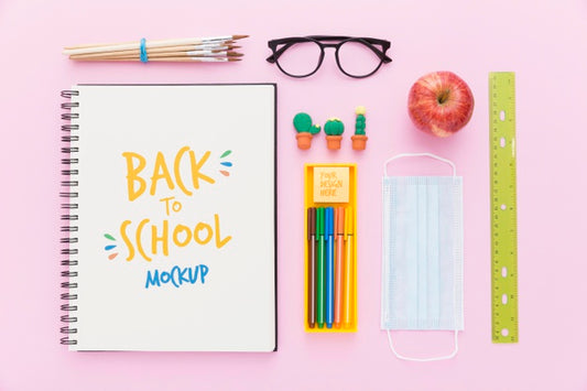 Free Top View Of Back To School Notebook With Apple And Glasses Psd