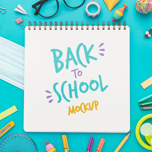 Free Top View Of Back To School Notebook With Glasses And Pencils Psd
