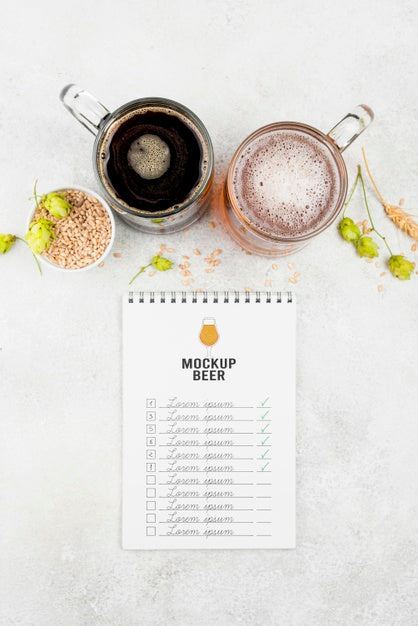 Free Top View Of Beer Pints With Barley And Notebook Psd