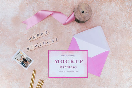 Free Top View Of Birthday Envelope With Ribbon And Card Psd