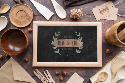 Free Top View Of Blackboard With Wooden Dishes Psd