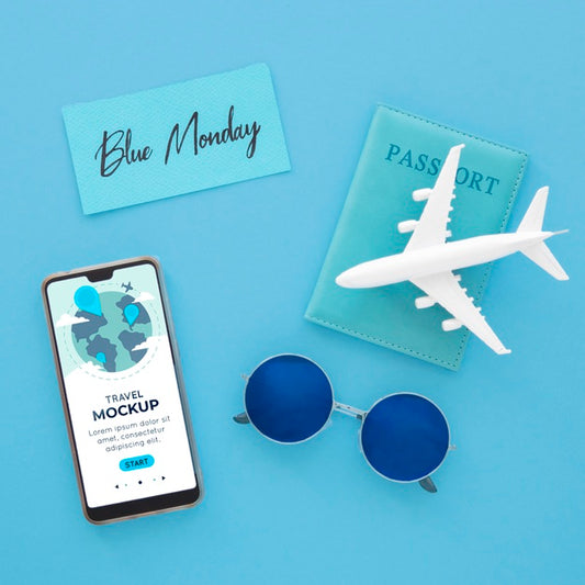 Free Top View Of Blue Monday Airplane With Smartphone And Sunglasses Psd
