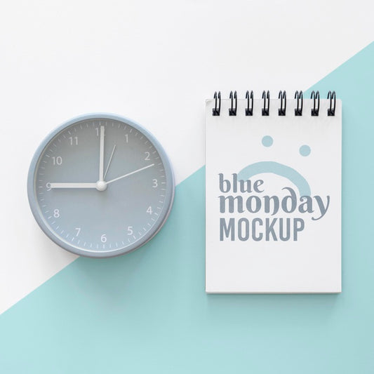 Free Top View Of Blue Monday Notebook With Clock Psd