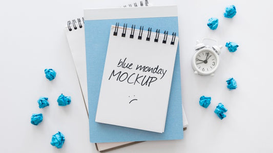 Free Top View Of Blue Monday Notebooks With Alarm Clock Psd