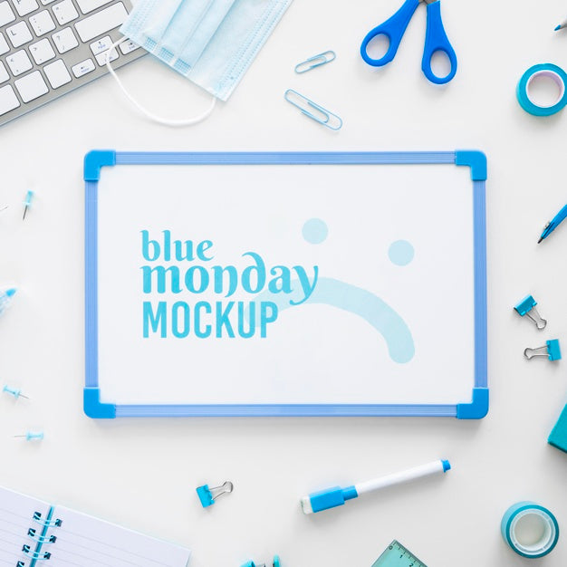 Free Top View Of Blue Monday Whiteboard With Scissors And Stationery Psd