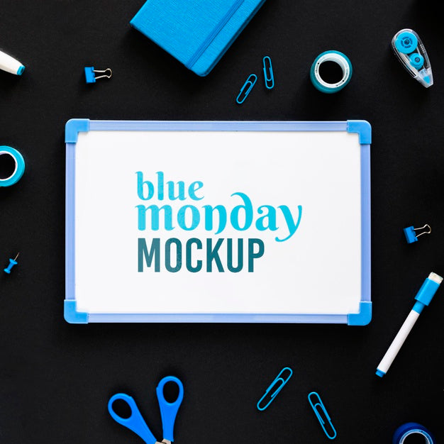 Free Top View Of Blue Monday Whiteboard With Stationery Psd