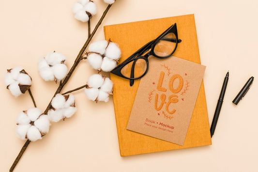 Free Top View Of Book With Glasses And Cotton Psd