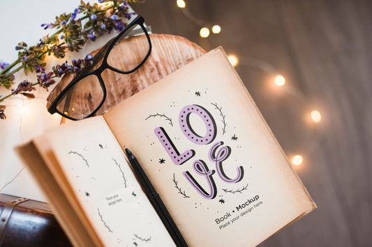 Free Top View Of Book With Glasses And Lights Psd