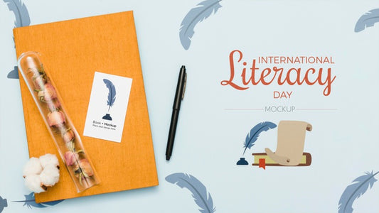 Free Top View Of Book With Pen And Flowers Psd