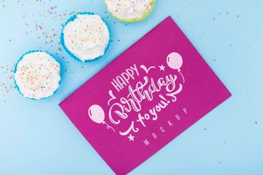Free Top View Of Card With Happy Birthday And Cupcakes Psd