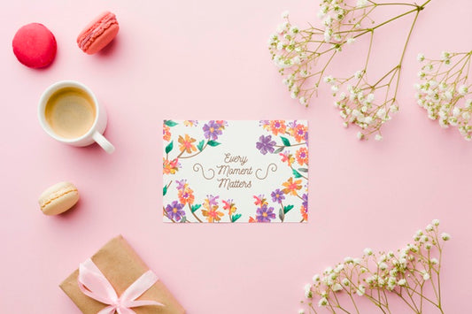 Free Top View Of Card With Present And Flowers Psd