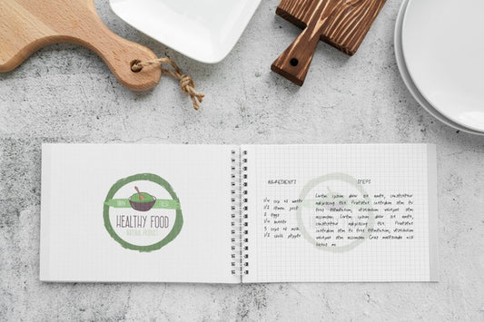 Free Top View Of Chopping Board With Notebook Psd