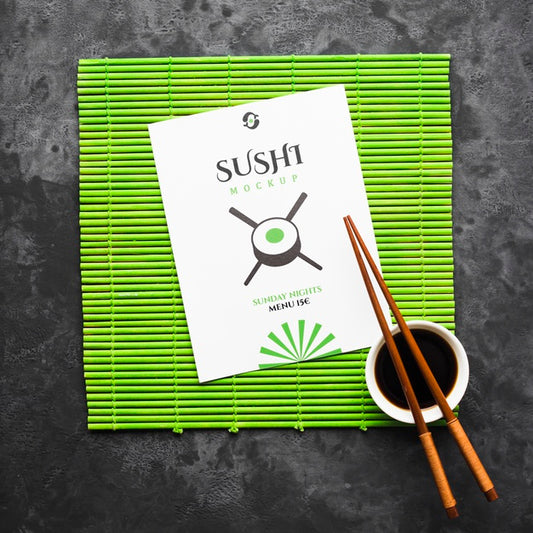 Free Top View Of Chopsticks With Soy Sauce On Bamboo Roller For Sushi Psd