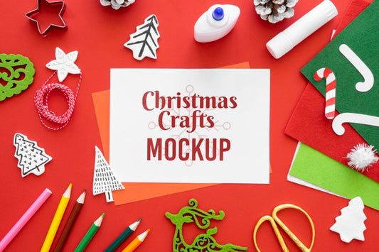 Free Top View Of Christmas Crafts With Crayons And Paper Psd