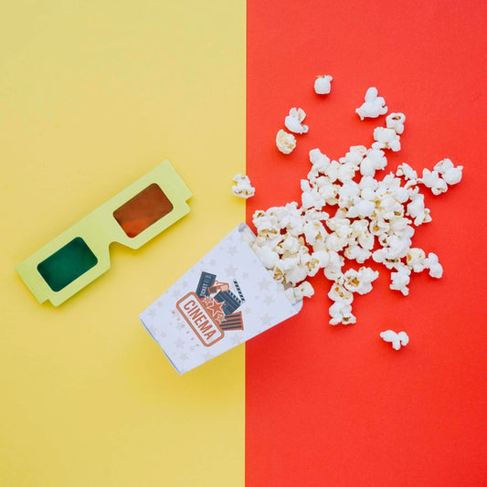 Free Top View Of Cinema Popcorn In Cup With Glasses Psd
