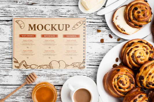 Free Top View Of Cinnamon Buns With Coffee And Honey Psd