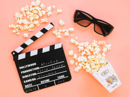 Free Top View Of Clapperboard With Popcorn Psd