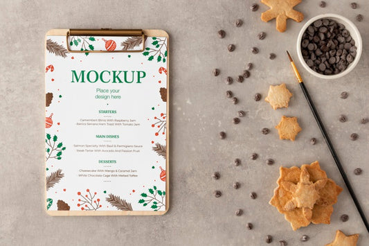 Free Top View Of Clipboard With Snowflake Cookies And Chocolate Chips Psd