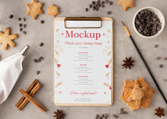 Free Top View Of Clipboard With Snowflake Cookies And Cinnamon Psd