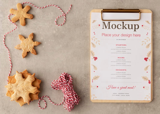 Free Top View Of Clipboard With Snowflake Cookies And String Psd