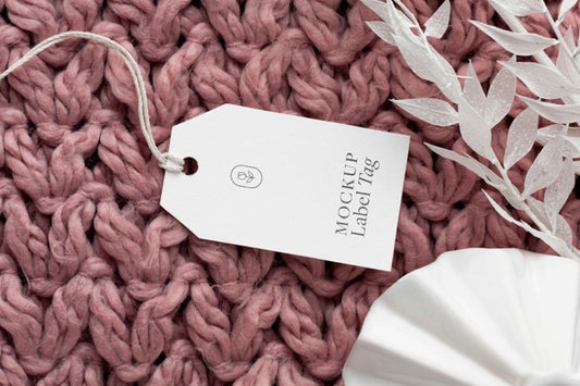 Free Top View Of Clothing Label Mock-Up On Knitted Fabric Psd