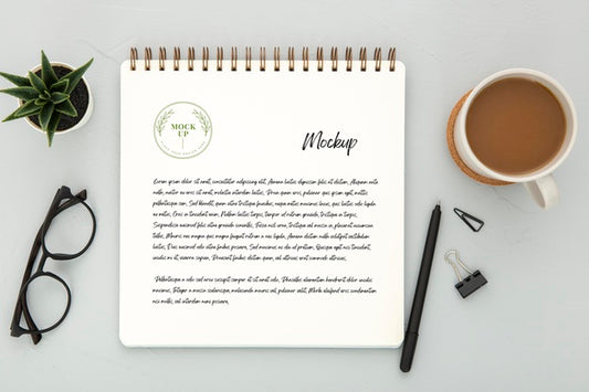 Free Top View Of Desk Surface With Coffee And Pen Psd