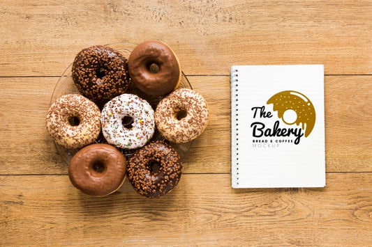 Free Top View Of Donuts With Notebook Psd