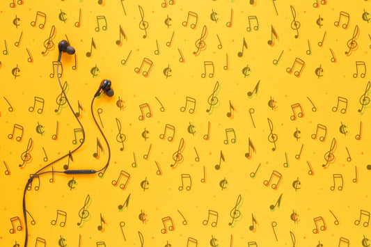 Free Top View Of Earphones On Yellow Background With Copy Space Psd