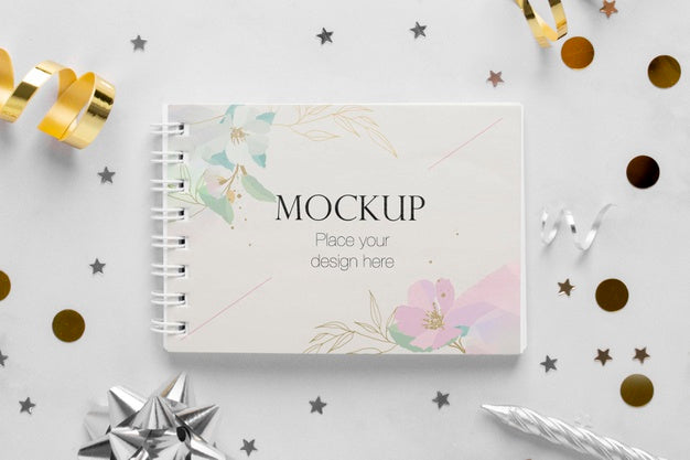 Free Top View Of Elegant Birthday Notebook With Ribbon And Confetti Psd