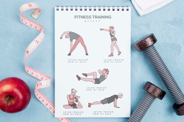 Free Top View Of Fitness Notebook With Apple And Weights Psd