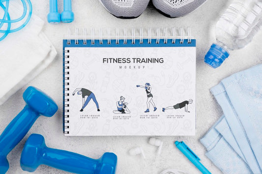 Free Top View Of Fitness Notebook With Sneakers And Weights Psd