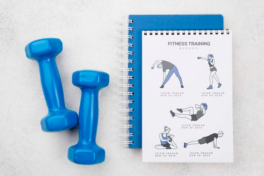 Free Top View Of Fitness Notebook With Weights Psd