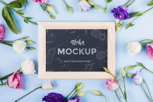 Free Top View Of Frame Mock-Up With Assortment Of Flowers Psd