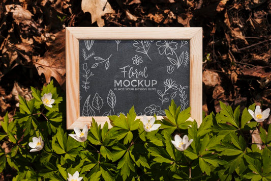 Free Top View Of Frame Mock-Up With Leaves And Vegetation Psd
