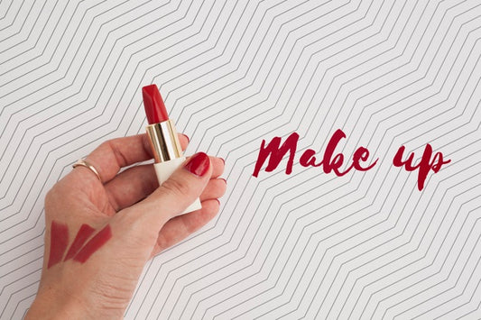 Free Top View Of Hand And Lipstick Mock-Up Psd
